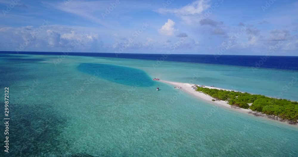 small fishing boat in the tropical ocean, wild sandbank island with exotic vegetation small fishing boat in the tropical ocean, wild sandbank island with exotic vegetation