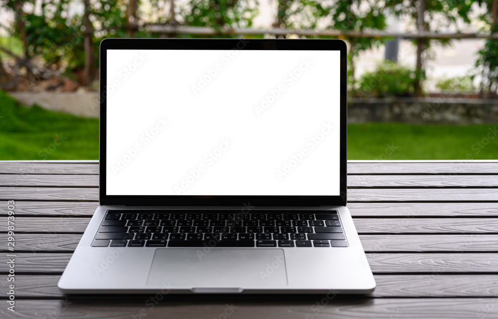 Blank screen laptop computer on wood table with clipping path. business concept. Mockup with copy space. Blank screen laptop computer on wood table with clipping path. business concept. Mockup with copy space.