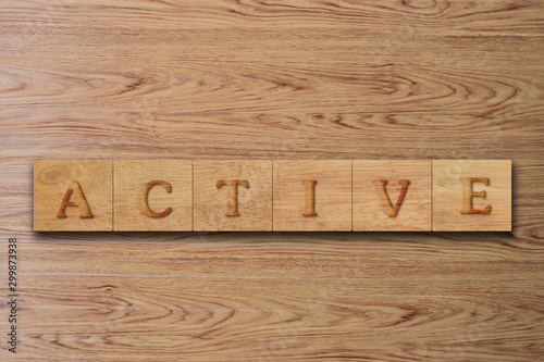 Active word letters on wood block. message text on wooden table for backdrop design.