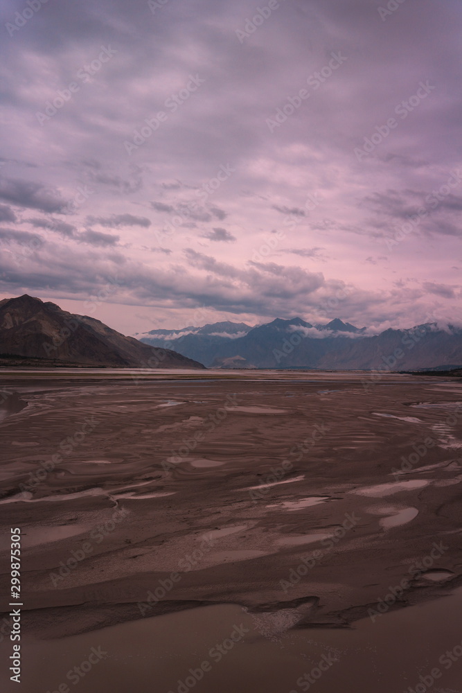 Fototapeta premium landscape view of the Indus river flowing through Katpana cold desert in Skardu, Gilgit Baltistan, Pakistan.