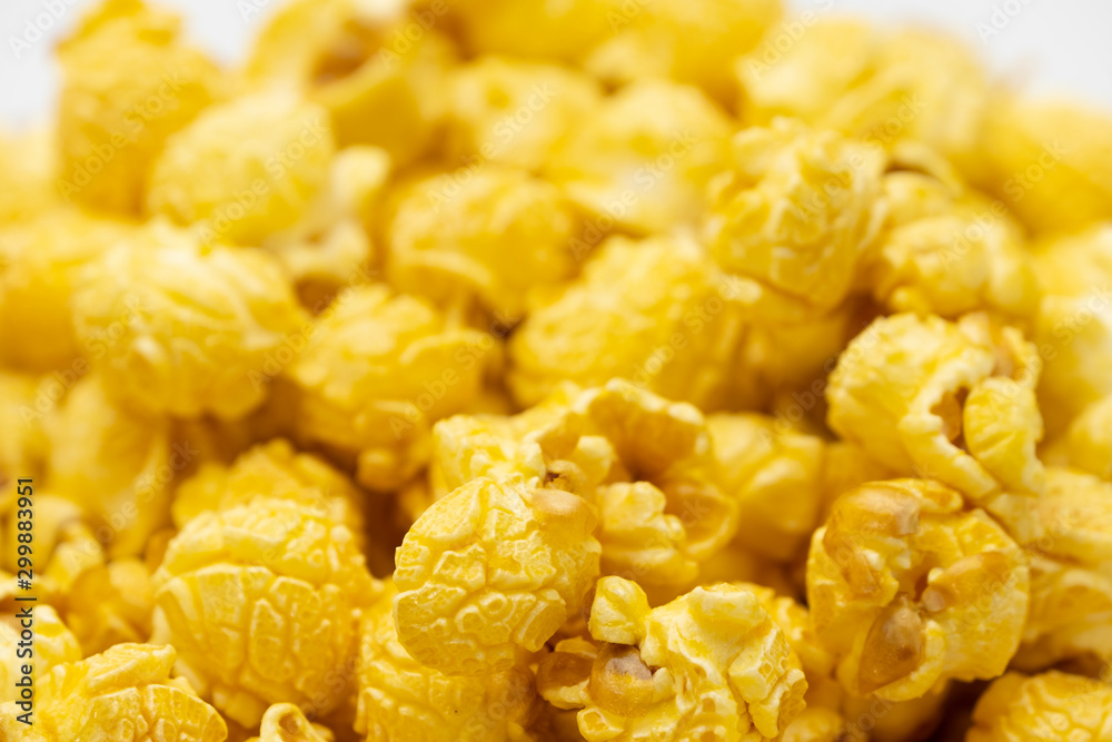Butter caramel popcorn in wooden bowl bulk on white background, Popular snack with favorite movie Butter caramel popcorn in wooden bowl bulk on white background, Popular snack with favorite movie