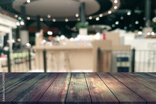 Top desk with blur restaurant background,wooden table © sirawut