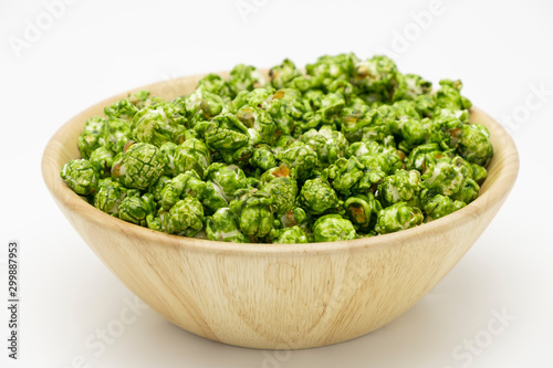 Lush of Japanese matcha green tea popcorn in the wooden bowl bulk, Popular snack with favorite movie