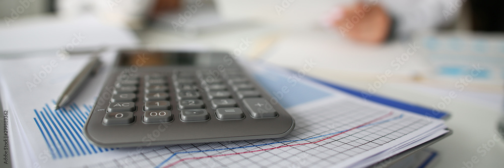 Pen lie on blue financial statistic analisys chart Pen lie on blue financial statistic analisys chart
