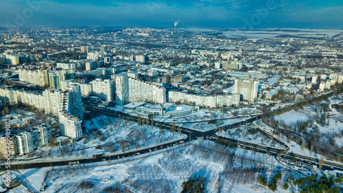 Top view of city in winter at sunset on sky background. Aerial drone photography concept. Kishinev, Republic of Moldova.