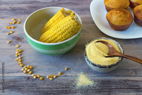 Boiled corn cobs, cornmeal and cornbread prepared as a muffin ( proja ). Rustic background photo