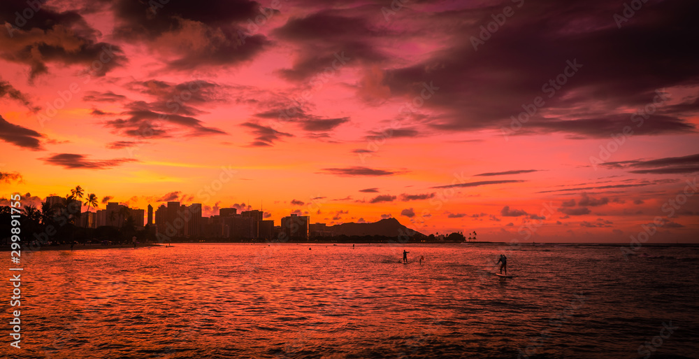 Sunrise at Ala Moana Beach Park with Paddleboarders in Oahu, Hawaii