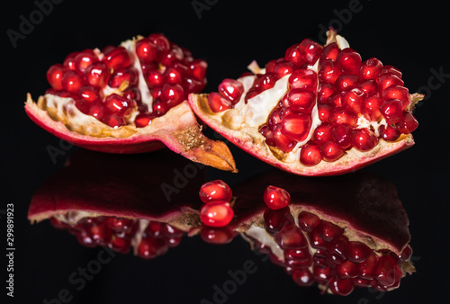 ripe pomegranate fruit with reflection