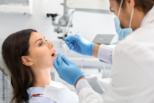 Young woman having check up in newest dental clinic