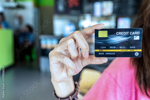 Hand woman showing credit card for business online