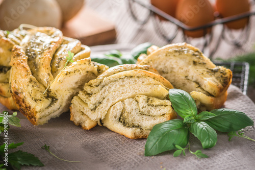 Homemade bread with basil pesto and fresh herbs