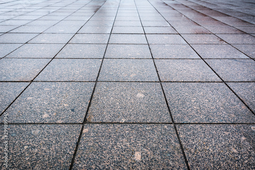 The texture of gray coarse paving slabs