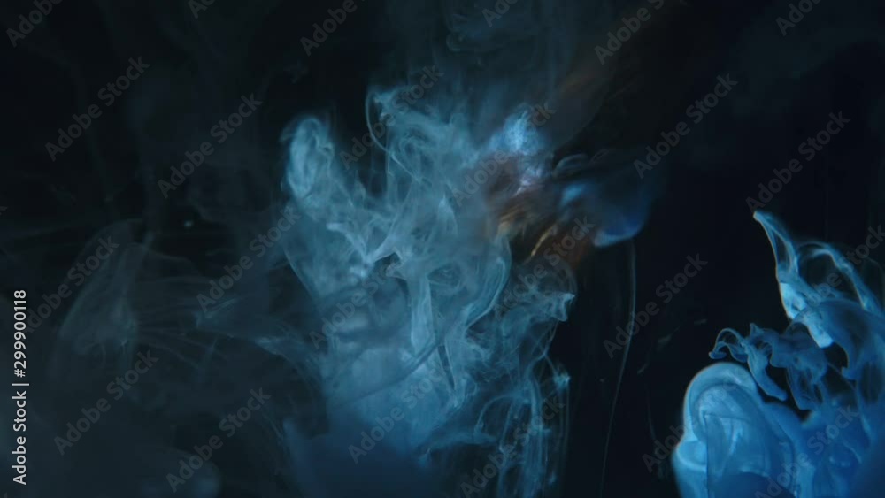 Paint brush is place in water. The artist draw picture. Paintbrush with acrylic blue ink dipped in liquid. Real visual effect spray in liquid by drop. Paint brush is place in water. The artist draw picture. Paintbrush with acrylic blue ink dipped in liquid. Real visual effect spray in liquid by drop.