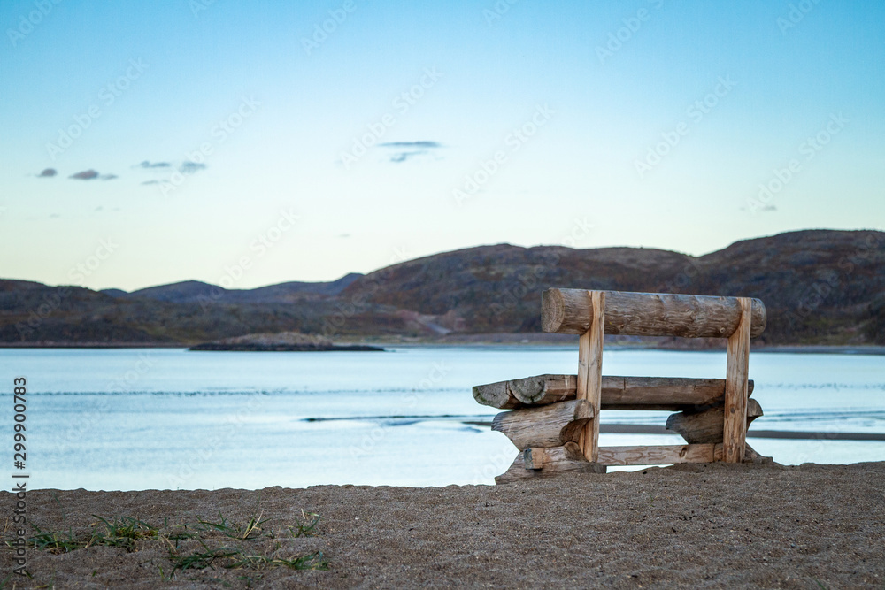 Fototapeta premium Teriberka. Bench on the coast of the Arctic Ocean. Russia.