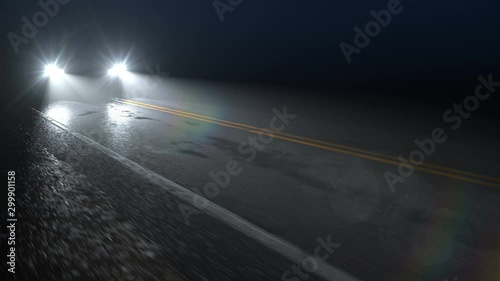 Car or truck drives down night wet road with headlights turned on, seamless loop. Automotive vehicle driving along country roa at slow speed with modern LED headlights on.