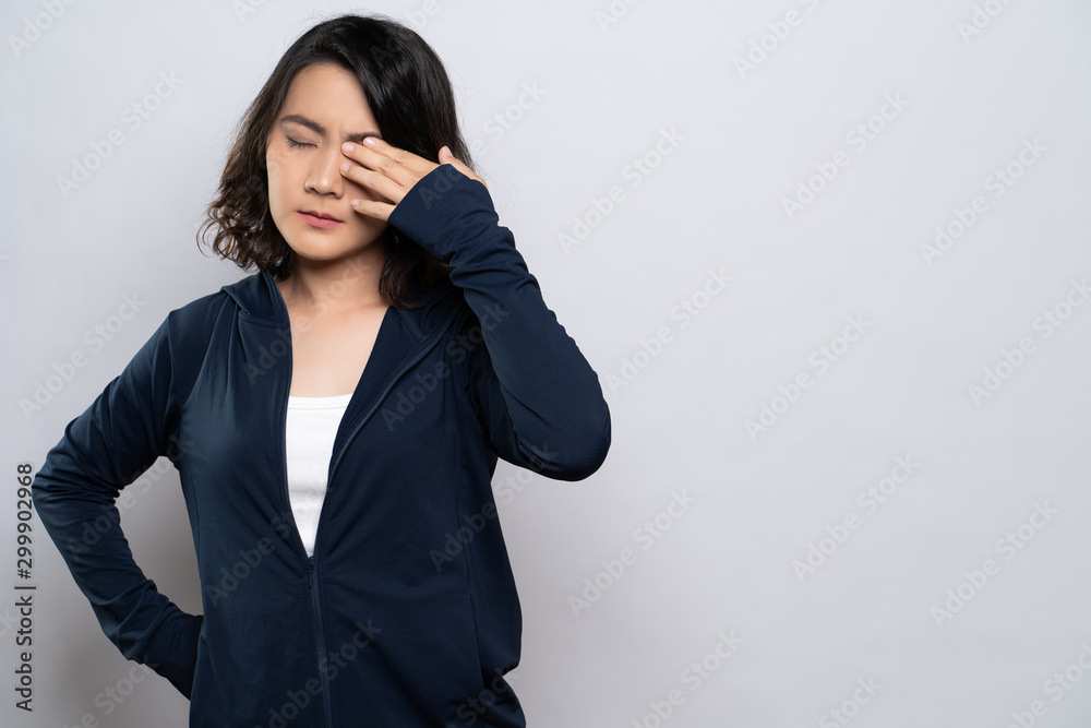 Woman has eyes pain isolated over white background Woman has eyes pain isolated over white background
