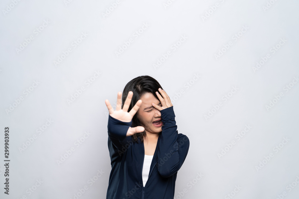 Woman feel scared standing isolated over white background Woman feel scared standing isolated over white background