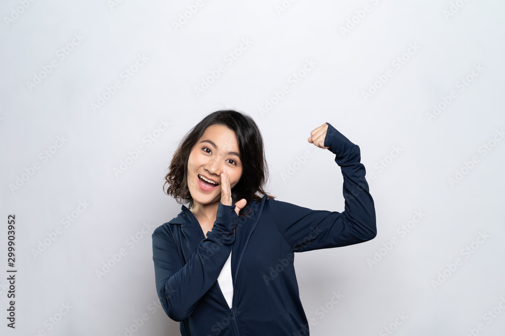 Portrait of a healthy woman make whisper gesture isolated over white background Portrait of a healthy woman make whisper gesture isolated over white background