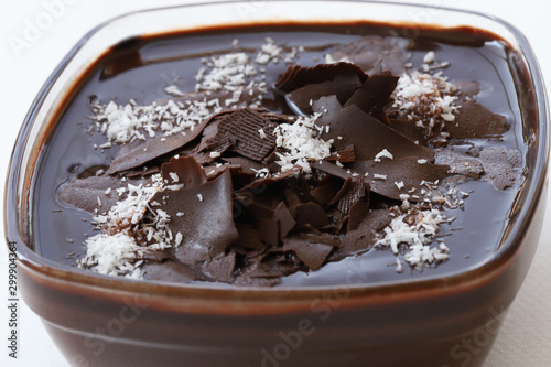 Supangle (pudding) dessert in glass bowl, on white background. photo