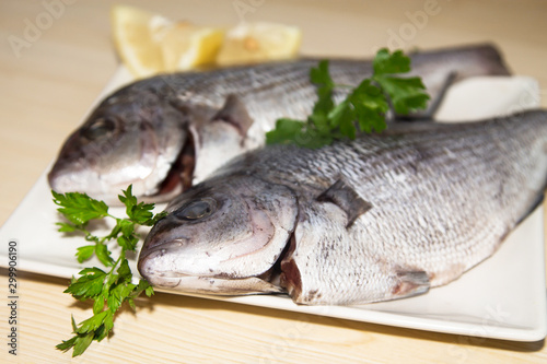 fresh fish with lemon and parsley