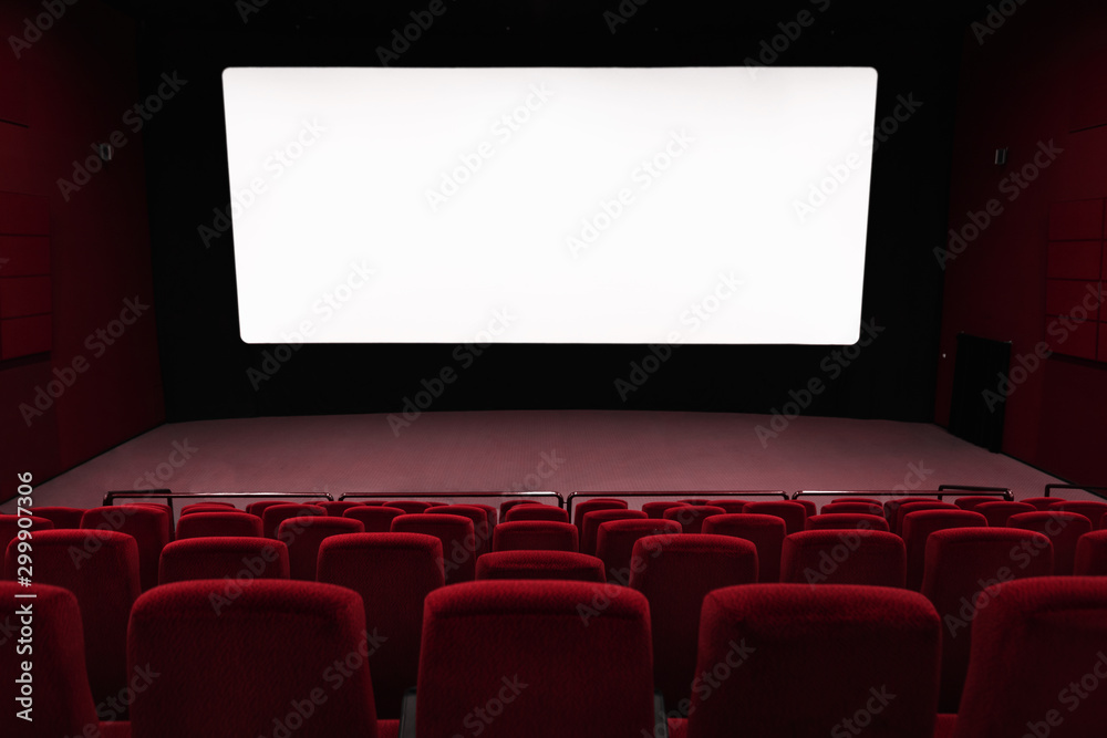 Empty of cinema in blue color with white blank screen. Mockup of hall, no people and auditorium Empty of cinema in blue color with white blank screen. Mockup of hall, no people and auditorium