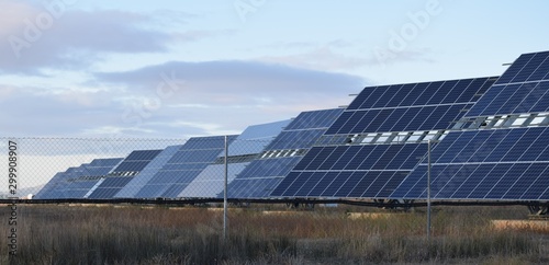 Solar panels in farm of solar panels in the field. New technology to generate electricity