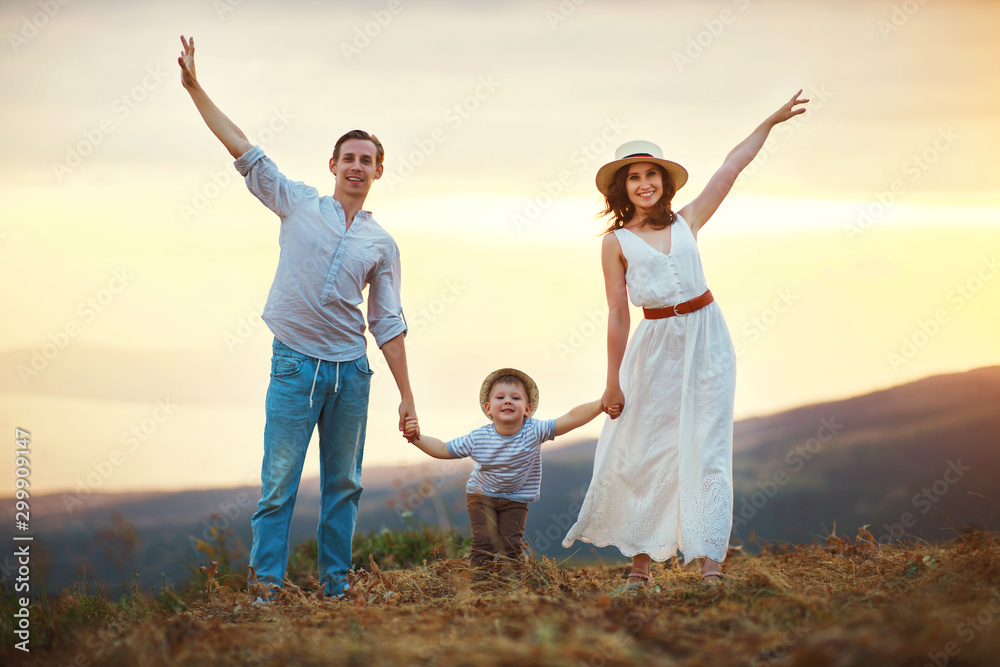 Happy family father of mother and child son on nature at sunset. Happy family father of mother and child son on nature at sunset.