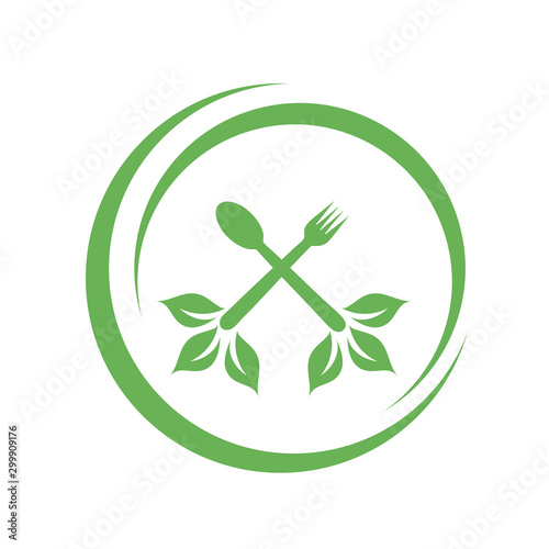 Cafe or restaurant serving Organic food logo- leaves from spoon and fork symbolizing Vegan friendly diet by European Vegetarian Union photo