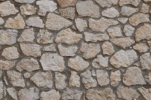 Stone and cement wall background, light brown color