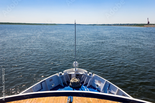 The stern of a ship sailing along the river photo