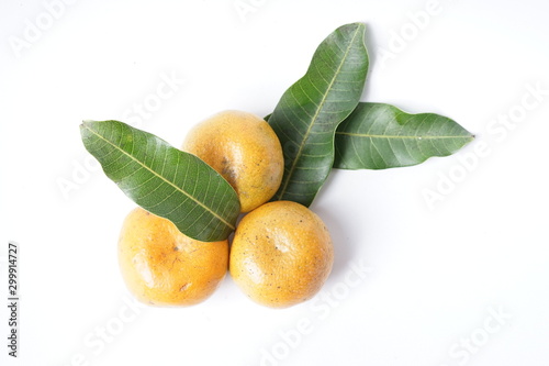 Pile of citrus orange fruit "sinensis" with some leaf - isolated white background