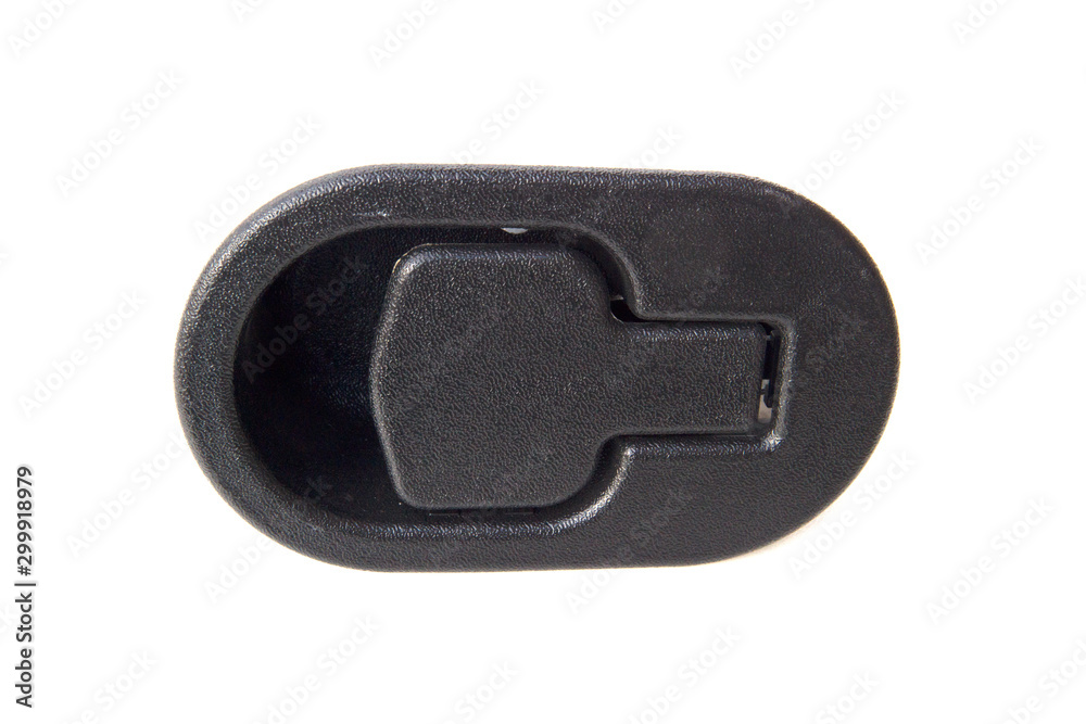 Black plastic object on a computer table used for strapping wires and cords together. Black plastic object on a computer table used for strapping wires and cords together.