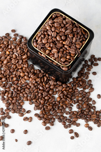 Coffee in metal jar on white background top view