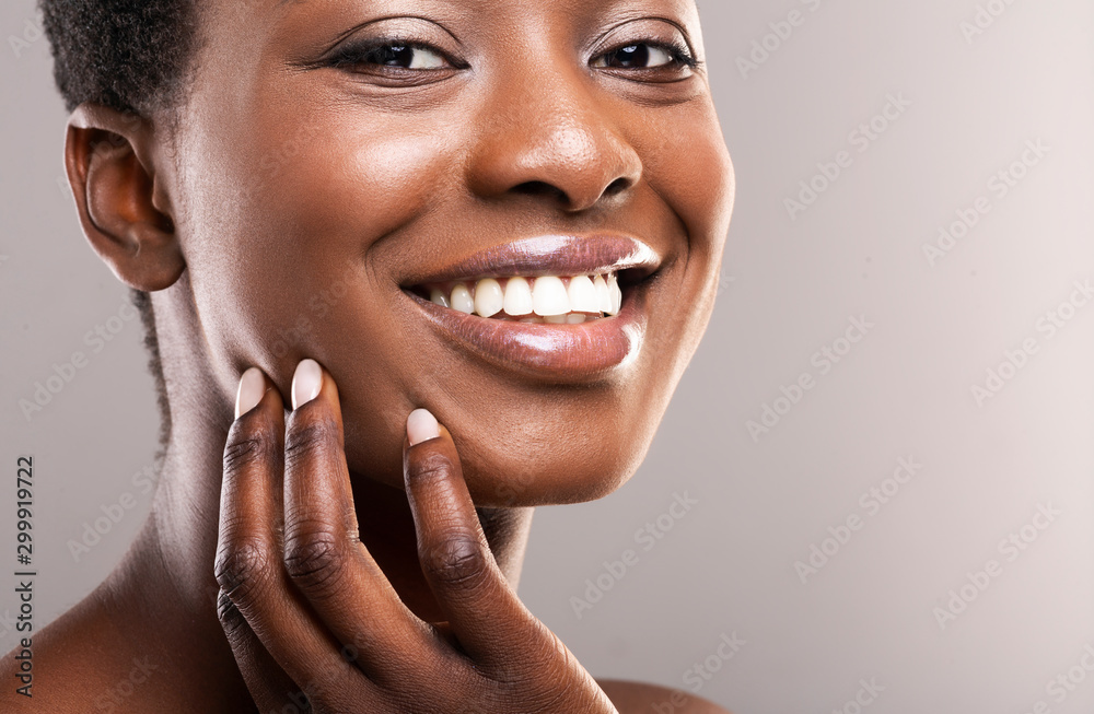 Beautiful black girl with perfect smooth skin touching her face Stock ...