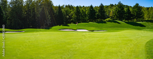 Fototapeta Naklejka Na Ścianę i Meble -  Panorama View of Golf Course with beautiful putting green. Golf course with a rich green turf beautiful scenery.