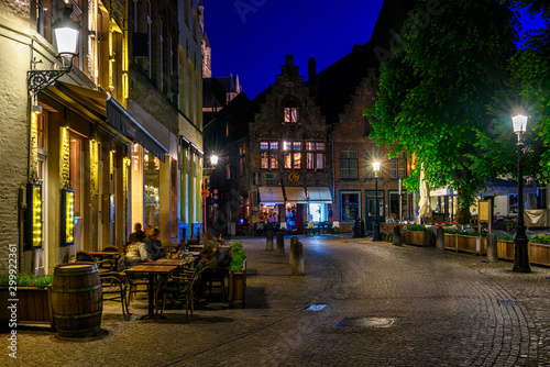 Old street in Bruges (Brugge), Belgium. Night cityscape of Bruges. Typical architecture of Bruges