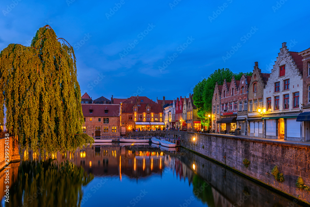 Fototapeta premium Typical view of the historic city center of Bruges (Brugge), West Flanders province, Belgium. Night cityscape of Bruges.