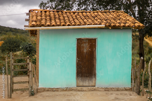 A green humble house in the interior of Bahia, northeast of Brazil