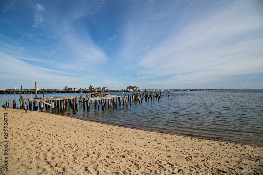 Old wrecked pier against blue sky in Provincetown, Cape Cod, Massachusetts