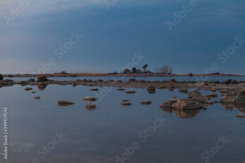 Estonian treasure, cape Purekkari, 1.5 km long, covered with rocks and boulders, and located on the Pärispea Peninsula in Lahemaa National Park. Late sunset photo