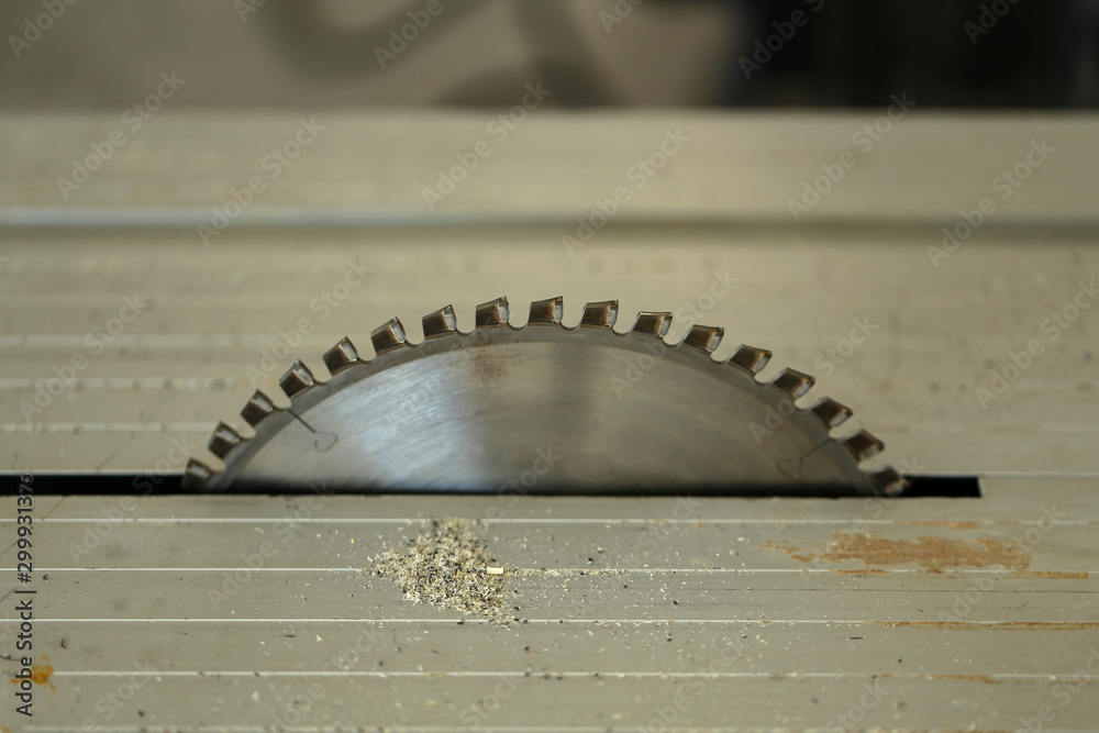 Closeup of circular saw on bench of woodworking