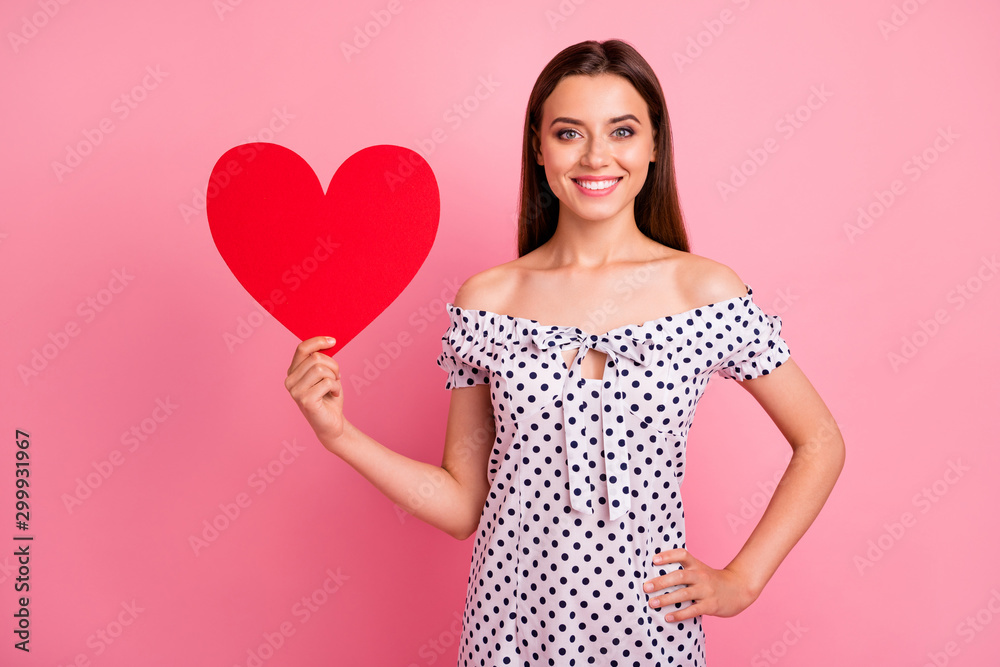 Close up photo of nice cute glad cheerful girlfriend boasting about heart shaped vivid red paper she received from her boyfriend while isolated with pink background Close up photo of nice cute glad cheerful girlfriend boasting about heart shaped vivid red paper she received from her boyfriend while isolated with pink background