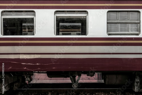 Fotografi Side view of old vintage bogie and open and close window of diesel electric locomotive train on railroad track, Take picture from platform
