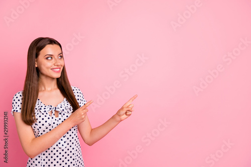 Photo of attractive cool good nice cute woman showing away at something really great while isolated with pink background © deagreez