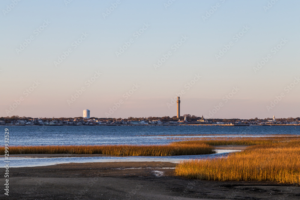 Pilgrim Monument Tower against blue sky background, Provincetown, Cape Cod, MA 