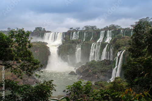 The main attraction of Brazil and Argentina is the famous Iguazu Falls among the lush green jungle. Huge streams of water fall to the ground. UNESCO World Heritage. Picture from paradise.