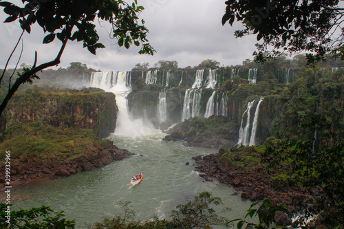 The main attraction of Brazil and Argentina is the famous Iguazu Falls among the lush green jungle. Huge streams of water fall to the ground. UNESCO World Heritage. Picture from paradise.