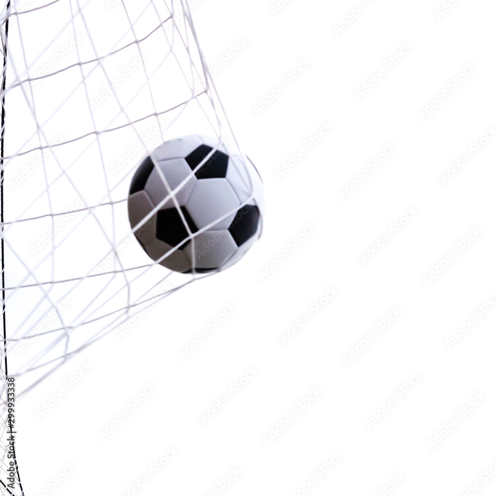 Naklejka premium Studio shot moving soccer ball in goal net isolated on white