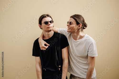 Slika na platnu Close Up Portrait of Two Stylish Twins Brothers Dressed in Black and White T-shi