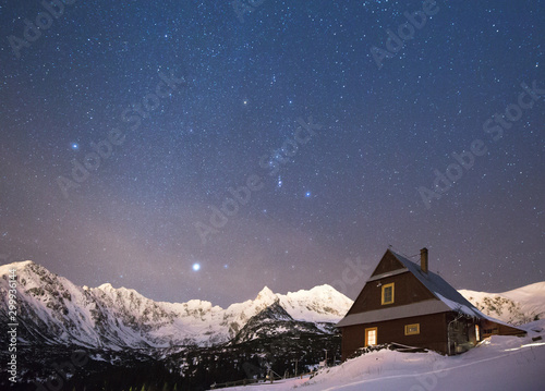 Night star photography of Tatra Mountains in Winter season © PawelUchorczak